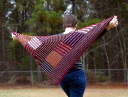Log Cabin Shawl knitting pattern by Cassie Castillo.  Worked in striped modular sections.  Great stash buster!