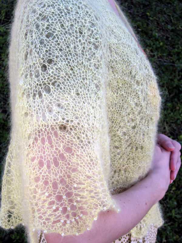 Mariposa Shawl knitting pattern by Cassie Castillo.  Feather and fan shawl with beaded lace border.