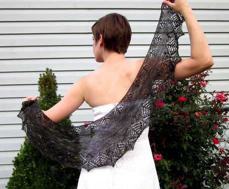 Graciella Shawl knitting pattern by Cassie Castillo.  Crescent shawl with lace and nupp border.