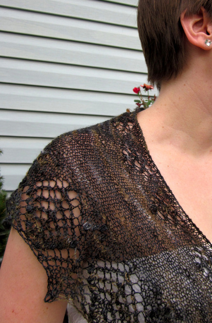 Graciella Shawl knitting pattern by Cassie Castillo.  Crescent shawl with lace and nupp border.