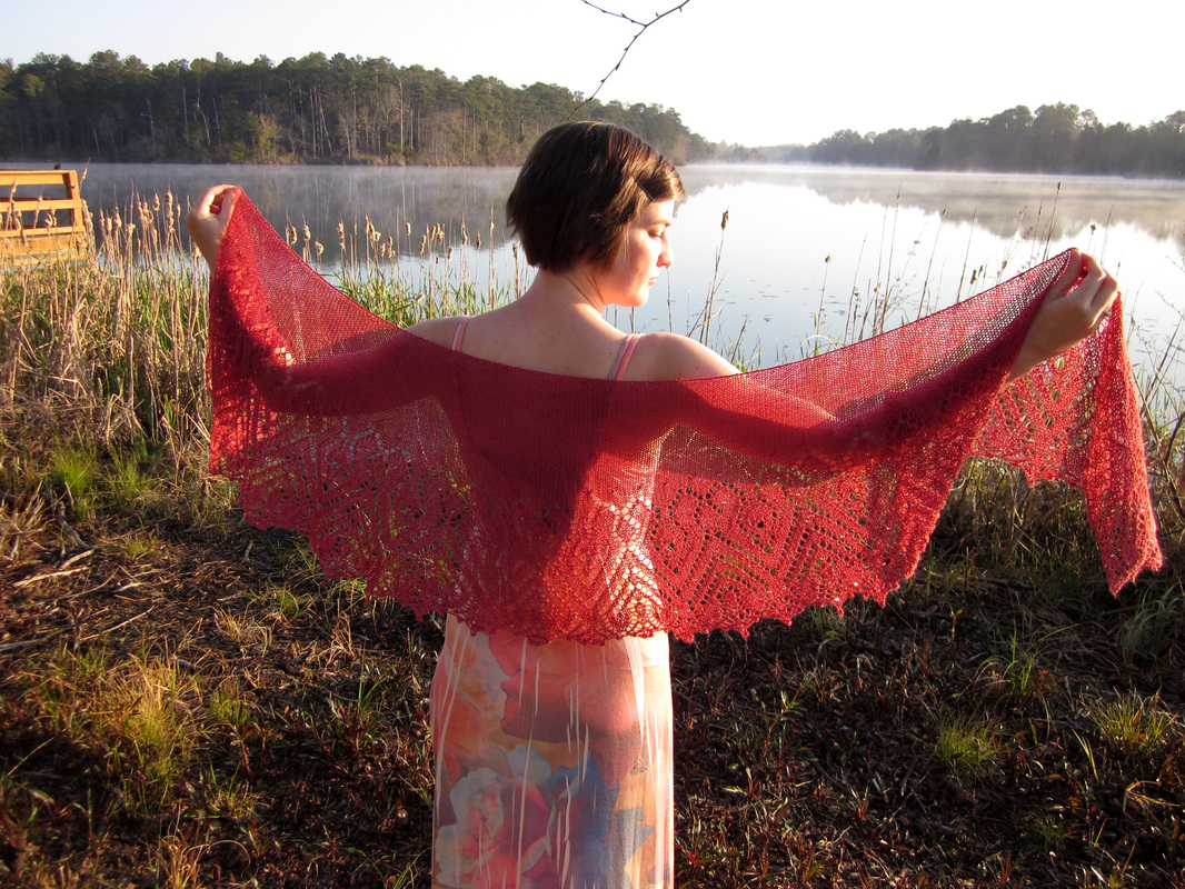 Rosana Shawl knitting pattern by Cassie Castillo.  Crescent shawl with beaded lace border.
