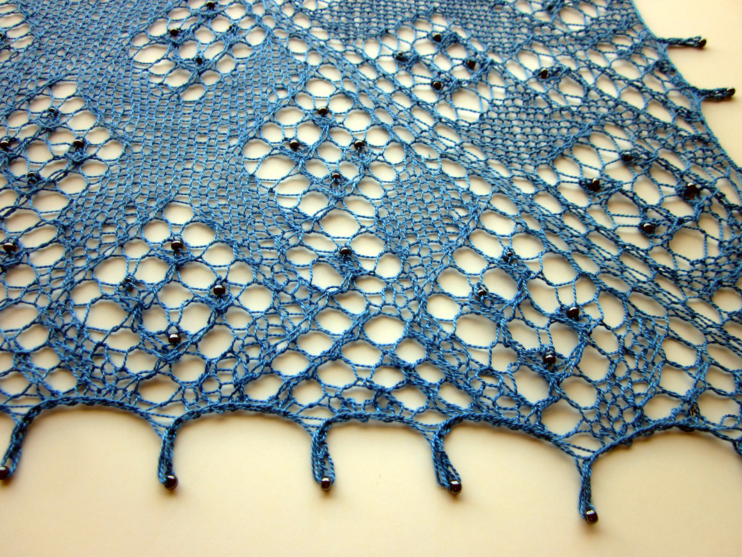 Ciara Shawl knitting pattern by Cassie Castillo.  Lace shawl with beads and picot edge.