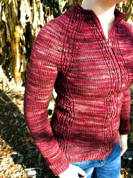 Lava Rock Cardigan knitting pattern by Cassie Castillo.  Bottom up raglan sweater with twisted stitches.
