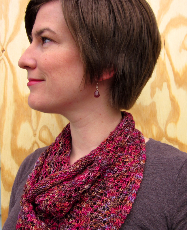 Rosewood Cowl knitting pattern by Cassie Castillo.  Triangle cowl worked flat in cables and lace.