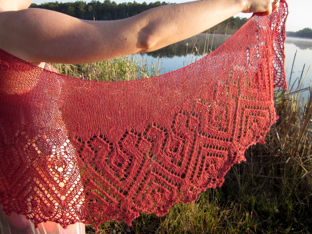 Rosana Shawl knitting pattern by Cassie Castillo.  Crescent shawl with beaded lace border.
