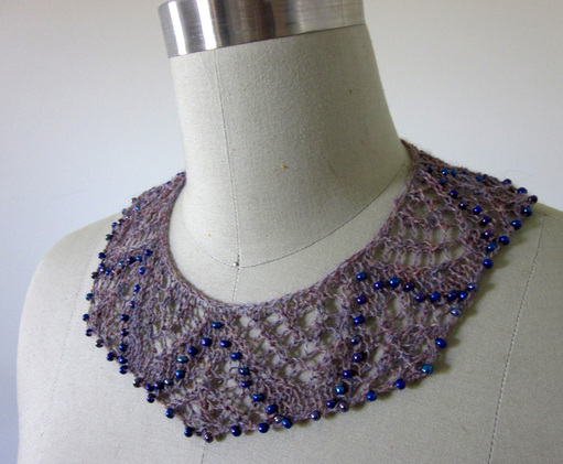 Saqqara Necklace knitting pattern by Cassie Castillo.  Beaded lace collar style necklace in two sizes.
