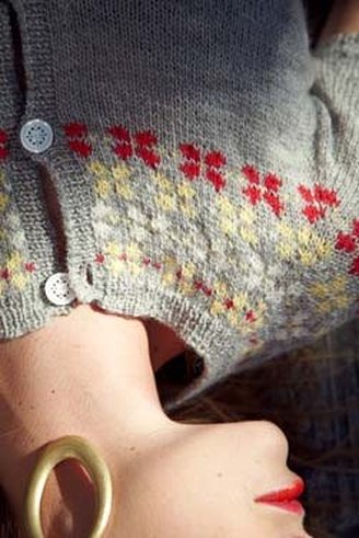 Edelweiss Cardigan knitting pattern by Cassie Castillo.  Stranded fair isle yoke sweater with flowers and short sleeves.